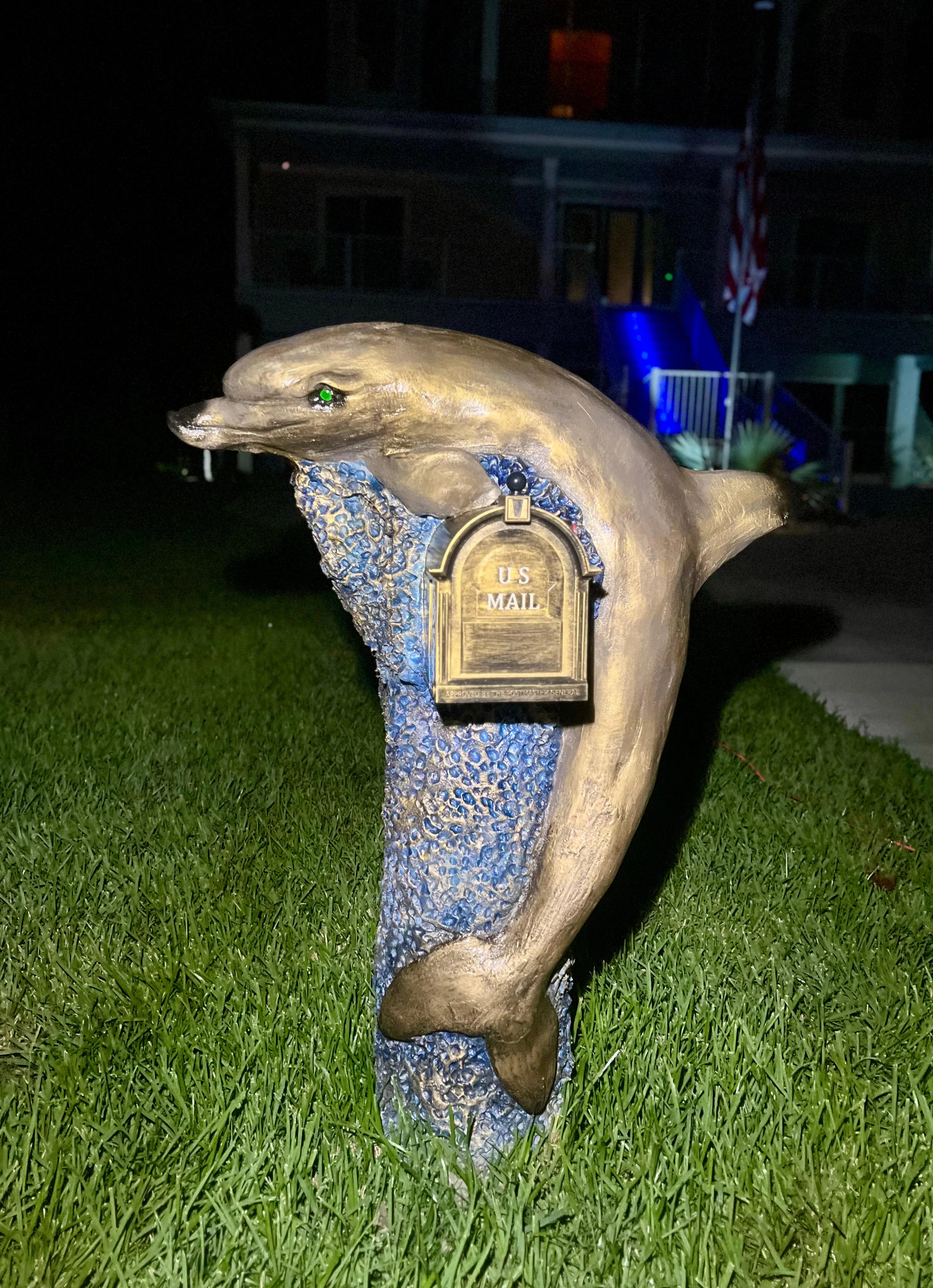 Handcrafted dolphin statue, bronze finish by Seaside Mailbox, nautical cement art for coastal homes.