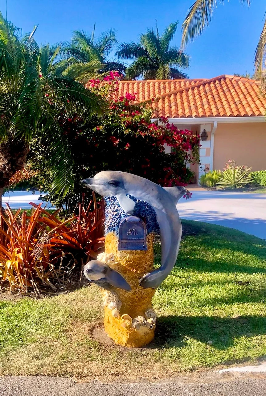 Handcrafted dolphin statue, mother by Seaside Mailbox, nautical cement art for coastal homes.