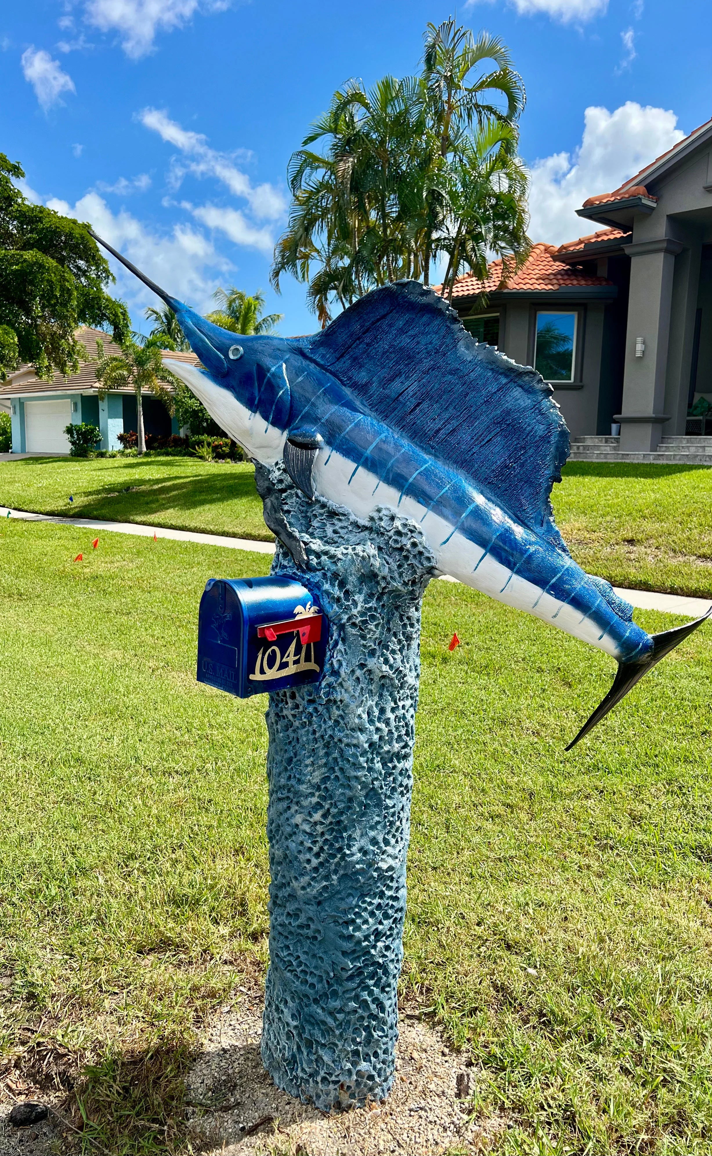 Handcrafted blue marlin statue, blue stripes by Seaside Mailbox, nautical cement art for coastal homes.