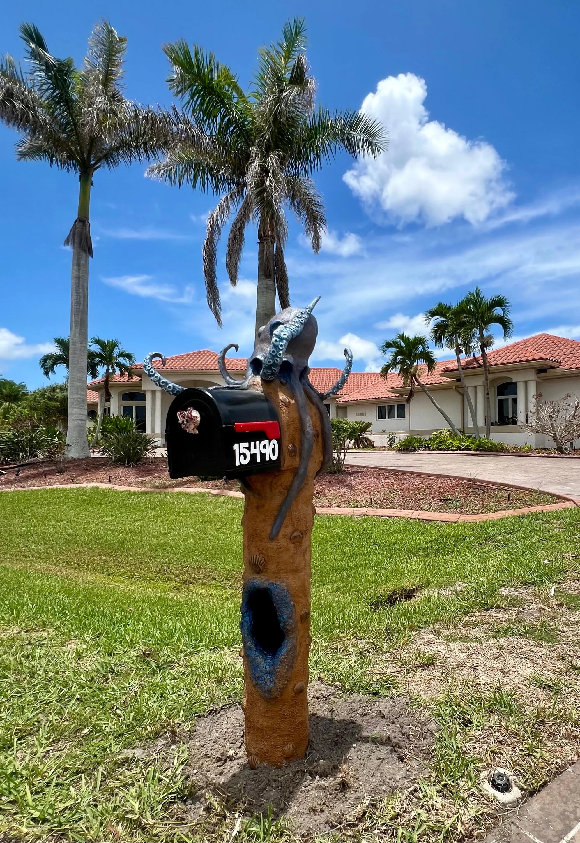 Handcrafted octopus statue, blue octopus by Seaside Mailbox, nautical cement art for coastal homes.