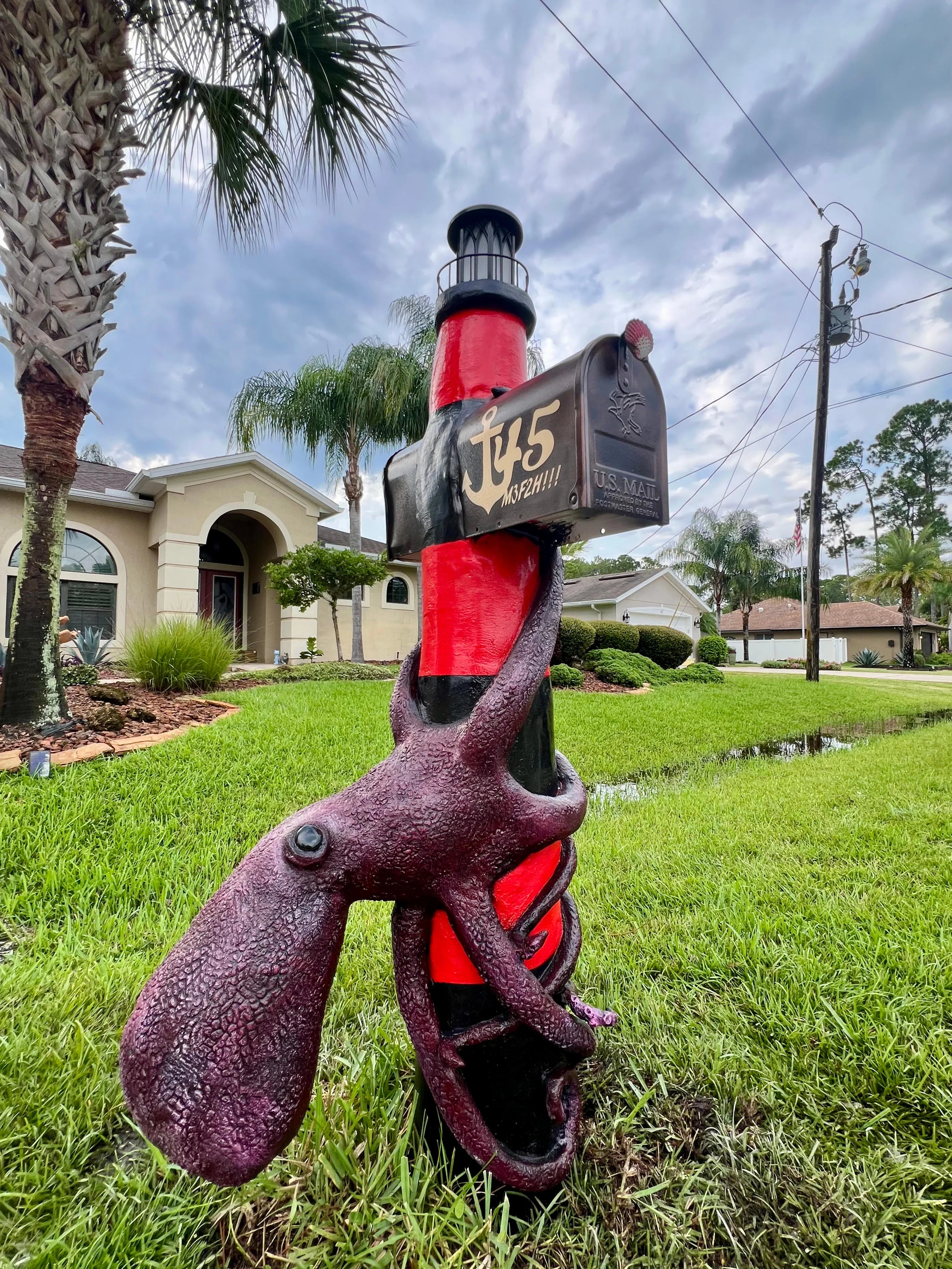 Handcrafted octopus statue, lighthouse post by Seaside Mailbox, nautical cement art for coastal homes.