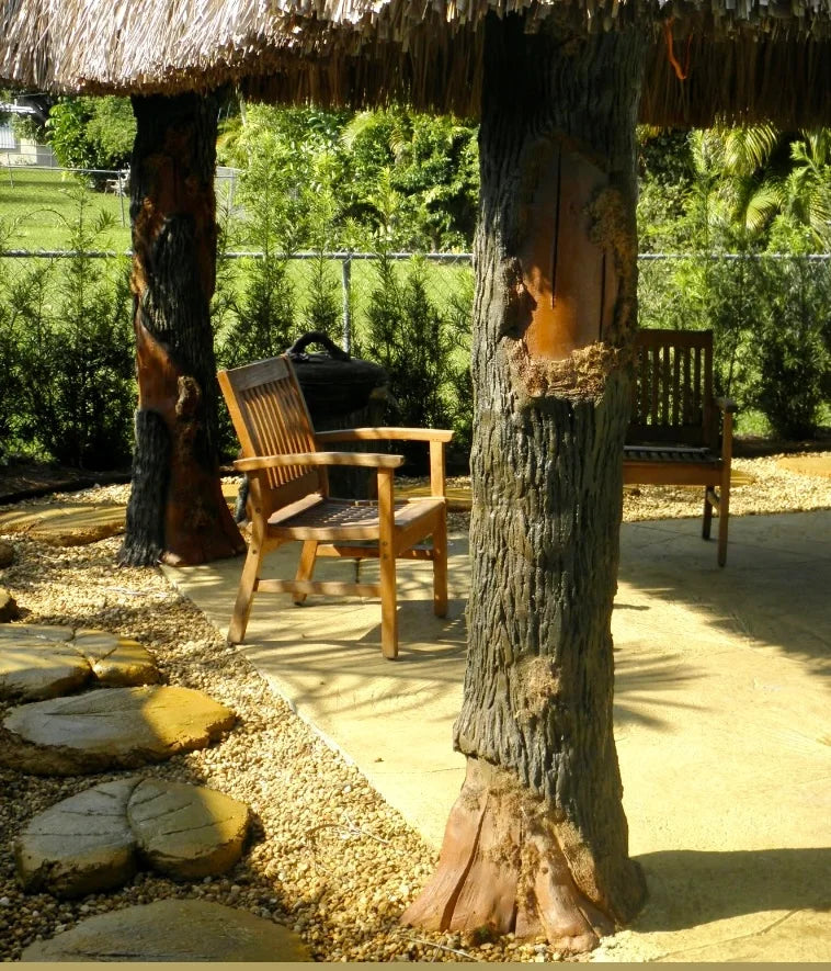 Handcrafted thatched roof, tree trunk posts by Seaside Mailbox, nautical cement art for coastal homes.