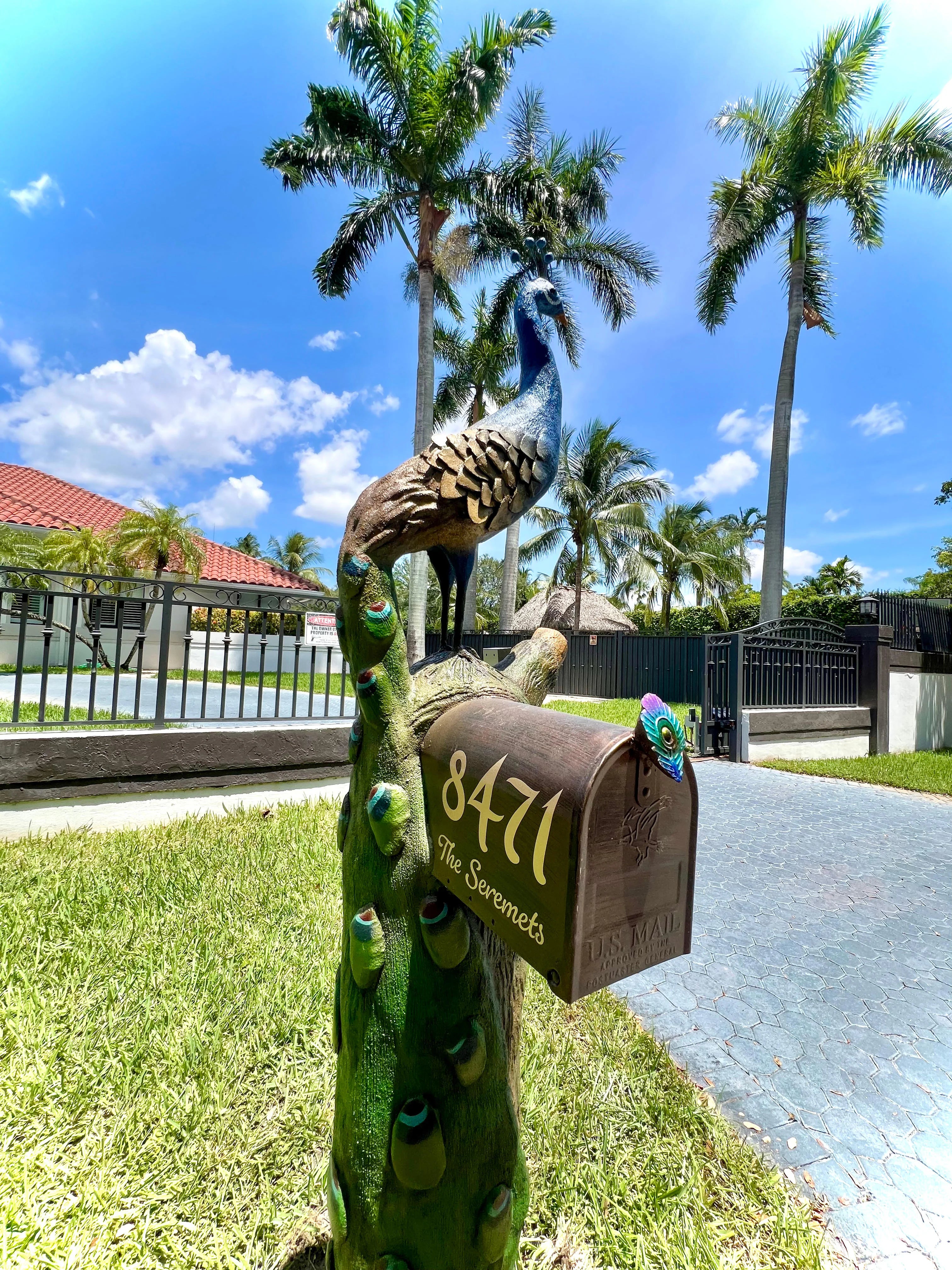 Handcrafted peacock statue, peacock feather by Seaside Mailbox, nautical cement art for coastal homes.