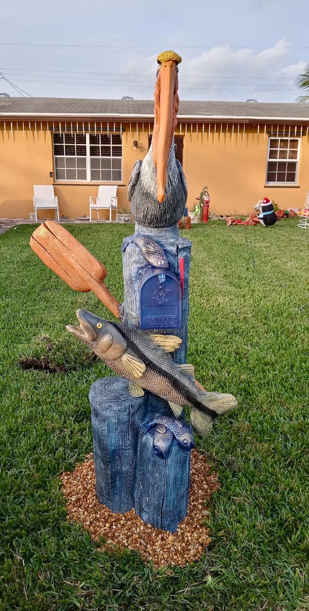 Handcrafted pelican statue, anchor by Seaside Mailbox, nautical cement art for coastal homes.
