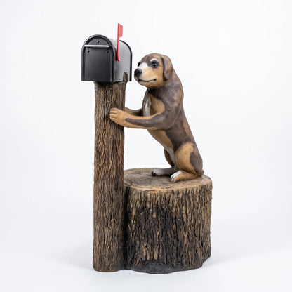 Puppy dog mailbox sculpture hugging a tree trunk post with black mailbox