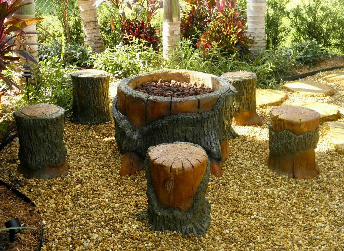 Handcrafted fire pit, tree stumps by Seaside Mailbox, nautical cement art for coastal homes.